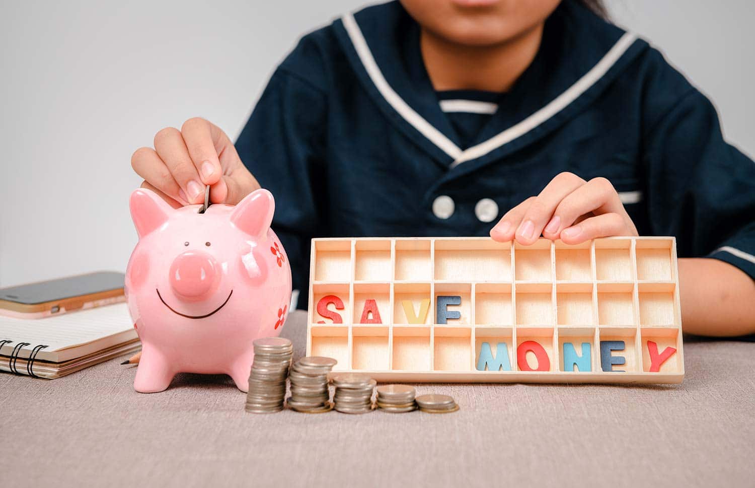 little girl coin piggy bank kids money saving tips